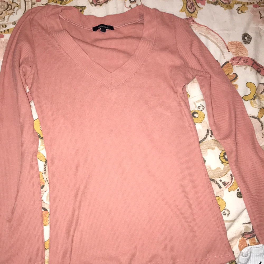 A pink long sleeve top